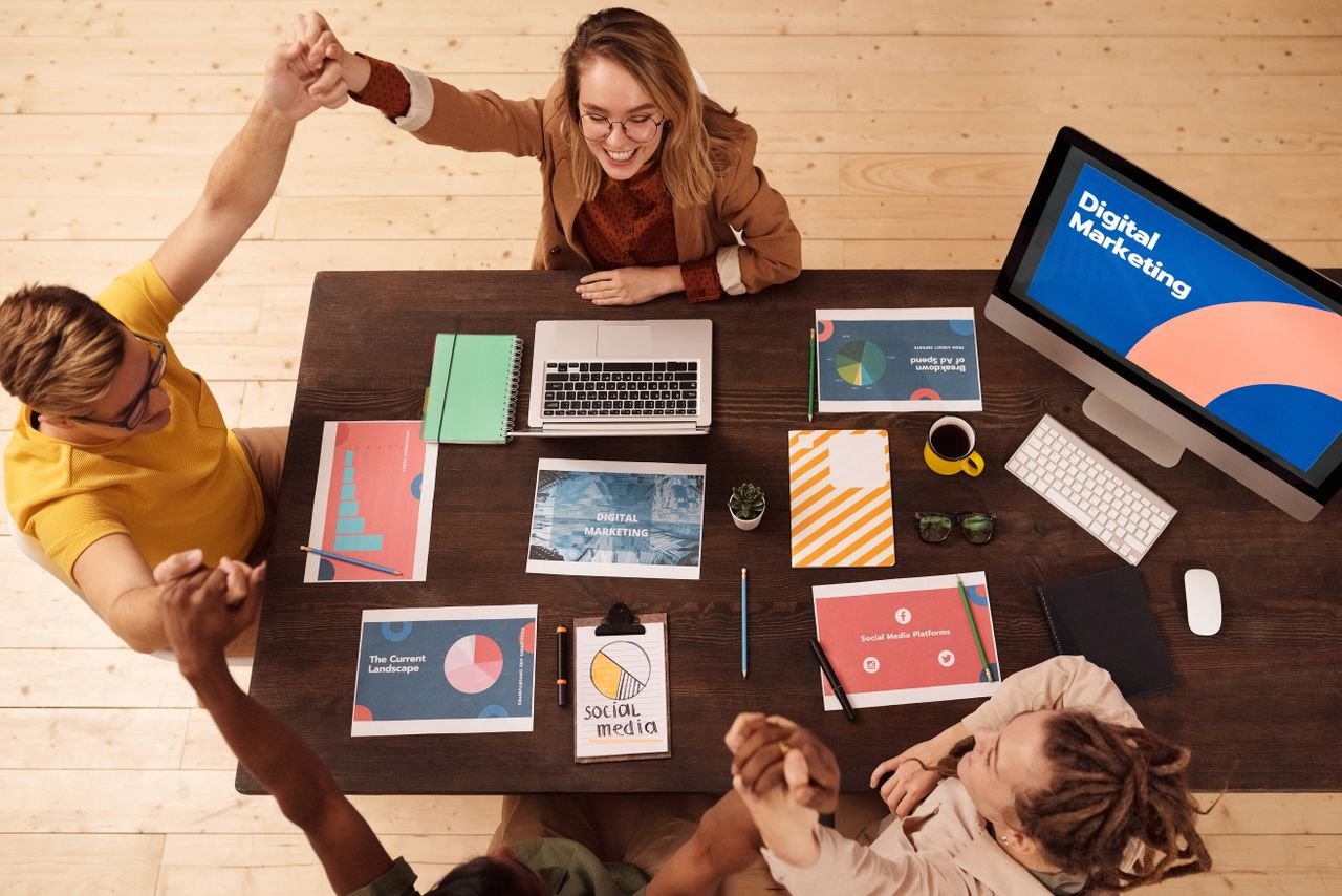 Crafting Captivating Headlines: Your awesome post title goes here Colleagues celebrating success in a modern digital marketing office with teamwork and collaboration.